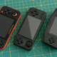 The RK2020 (middle) hits a sweet spot in terms of size between the RG350 (left) and the original Nintendo Game Boy Advance (right).